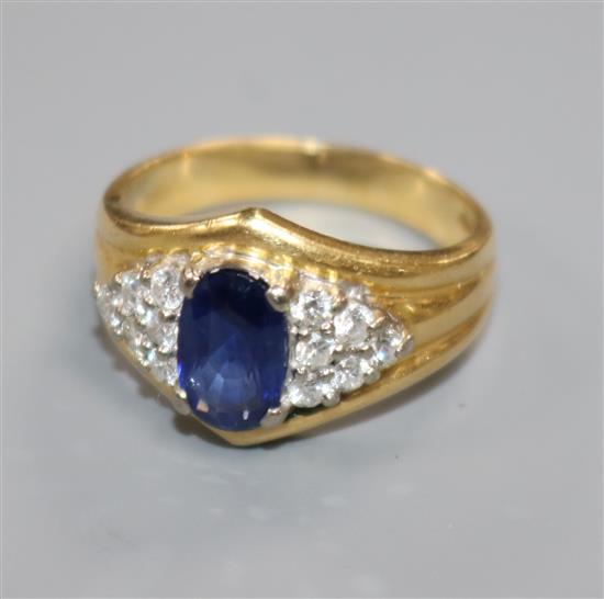 A modern 18ct gold, sapphire and diamond cluster dress ring, size O.